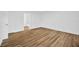 Bedroom featuring wood-look floors and freshly painted white walls at 5526 Southernview Dr, Zephyrhills, FL 33541