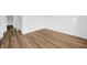This room has light wood flooring, white walls, and ample closet space, perfect for a bedroom or office at 5526 Southernview Dr, Zephyrhills, FL 33541
