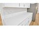 Bright kitchen features modern quartz countertop and decorative backsplash at 5526 Southernview Dr, Zephyrhills, FL 33541