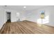 Spacious bedroom featuring wood floors and lots of natural light at 5526 Southernview Dr, Zephyrhills, FL 33541