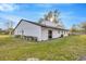 Rear exterior with a well-maintained lawn and charming fencing at 5526 Southernview Dr, Zephyrhills, FL 33541