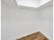 Inside walk-in closet with shelving and wood-look flooring at 5526 Southernview Dr, Zephyrhills, FL 33541