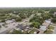 Aerial shot highlighting the property's desirable location, nestled among mature trees and close to local amenities at 601 Patricia Ave, Dunedin, FL 34698
