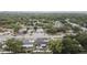 Street view shows homes and businesses shaded by mature trees, fostering a community-rich environment at 601 Patricia Ave # A, Dunedin, FL 34698