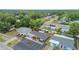 Property aerial featuring lush greenery and houses in a neighborhood setting at 601 Patricia Ave, Dunedin, FL 34698