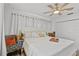 Well-lit bedroom featuring a large bed at 601 Patricia Ave, Dunedin, FL 34698