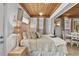 Tranquil bedroom with a wood ceiling, comfortable bed, and ample natural light at 601 Patricia Ave, Dunedin, FL 34698