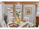 Bright dining area with a round table set for four, bathed in natural light and calming decor at 601 Patricia Ave, Dunedin, FL 34698