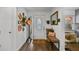 Inviting foyer featuring light walls and floors with a decorative front door and plenty of seating at 601 Patricia Ave, Dunedin, FL 34698