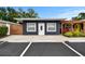 Attractive single-story home showcasing a stucco facade, white trim, and well-maintained landscaping at 601 Patricia Ave, Dunedin, FL 34698