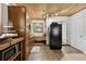 Functional kitchen featuring warm wood cabinetry, modern appliances, and a cozy window seat at 601 Patricia Ave, Dunedin, FL 34698