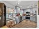 Updated kitchen features stainless steel appliances, granite countertops, and light gray cabinets at 601 Patricia Ave, Dunedin, FL 34698