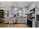This updated kitchen features stainless steel appliances, granite countertops, and lots of natural light at 601 Patricia Ave # A, Dunedin, FL 34698