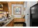 Close-up on a kitchen sink area, highlighting the cozy built-in bench by the window at 601 Patricia Ave, Dunedin, FL 34698