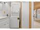 Laundry area with stacked washer and dryer in a bathroom at 601 Patricia Ave, Dunedin, FL 34698