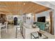 Spacious living room with a wood ceiling, comfortable seating, and modern amenities at 601 Patricia Ave, Dunedin, FL 34698