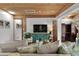 Cozy living room with a wood ceiling, plush seating, and elegant decor at 601 Patricia Ave, Dunedin, FL 34698
