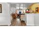 Comfortable living room featuring hardwood floors, neutral paint, ceiling fan, and bright natural light at 601 Patricia Ave, Dunedin, FL 34698