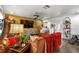 Eclectic living room with mustard colored wall, a giraffe sculpture, and a modern ceiling fan creating a unique, inviting space at 601 Patricia Ave, Dunedin, FL 34698