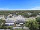 Aerial shot showing the property's location in a neighborhood with tree coverage at 601 Patricia Ave, Dunedin, FL 34698