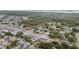 Overhead view showing the house nestled in a community near commercial establishments and roadways at 601 Patricia Ave, Dunedin, FL 34698