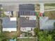 Aerial view showcasing a well-maintained home with a backyard, parking, and landscaping at 601 Patricia Ave, Dunedin, FL 34698