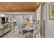 Elegant dining area adjacent to the living room, features seating for four and seamless flow throughout the home at 601 Patricia Ave, Dunedin, FL 34698