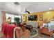 Cozy living room with unique decor, warm colors, and ample seating, creating an inviting and stylish atmosphere at 601 Patricia Ave, Dunedin, FL 34698