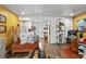 Inviting living room featuring colorful decor, wood-look floors, and plenty of natural light at 601 Patricia Ave, Dunedin, FL 34698