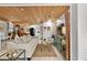 Inviting living room with stylish furnishings, a wood ceiling, and seamlessly connected to the dining and kitchen areas at 601 Patricia Ave, Dunedin, FL 34698