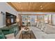 Bright and airy living room with a decorative ceiling, comfortable seating, and open flow to the bedroom at 601 Patricia Ave, Dunedin, FL 34698