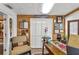 Cozy office featuring wood accents, a comfortable chair, and decorative elements creating a functional and inviting workspace at 601 Patricia Ave, Dunedin, FL 34698
