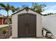 Durable outdoor storage shed with secure double door, great for storing tools and lawn equipment at 601 Patricia Ave, Dunedin, FL 34698