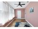 Unfurnished bedroom with light wood flooring, natural light, and a fan at 6015 19Th N St # 311, St Petersburg, FL 33714