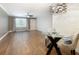 Modern dining room features hardwood floors, ceiling fan, designer lighting, and a window at 6015 19Th N St # 311, St Petersburg, FL 33714