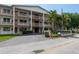 A spacious building with multiple stories, adorned with elegant columns and a well-maintained lawn at 6015 19Th N St # 311, St Petersburg, FL 33714