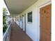 View of the hallway and apartment doors with unit numbers and exterior windows at 6015 19Th N St # 311, St Petersburg, FL 33714