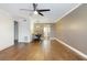 Living area with hardwood floors, designer lighting, dining table and access to the kitchen at 6015 19Th N St # 311, St Petersburg, FL 33714
