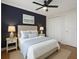 Cozy primary bedroom featuring a ceiling fan, soft colors, and ample closet space at 6015 19Th N St # 311, St Petersburg, FL 33714