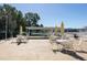 Relax at the outdoor patio with umbrella tables and chairs, overlooking a serene lake at 6015 19Th N St # 311, St Petersburg, FL 33714