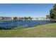 Scenic view of a community pond with lush landscaping, apartments, and tranquil water feature at 6015 19Th N St # 311, St Petersburg, FL 33714