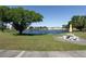 A picturesque view of the pond with a picnic table, offering a relaxing outdoor space at 6015 19Th N St # 311, St Petersburg, FL 33714