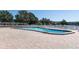 Community pool with brick pavers and lounge chairs provides a refreshing outdoor retreat at 6015 19Th N St # 311, St Petersburg, FL 33714