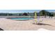 Community pool with brick pavers and lounge chairs, offering a refreshing spot for relaxation at 6015 19Th N St # 311, St Petersburg, FL 33714