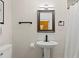 Bathroom featuring a modern sink, framed mirror, neutral walls, and new fixtures at 707 24Th Sw St, Largo, FL 33770