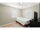 Bedroom featuring tile floors, neutral paint, and natural light from the windows at 707 24Th Sw St, Largo, FL 33770