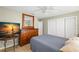 Bright bedroom featuring tile floors, a large closet, and a view of the TV at 707 24Th Sw St, Largo, FL 33770