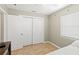 Bedroom with tile floors, neutral walls, natural light, and a double-door closet at 707 24Th Sw St, Largo, FL 33770