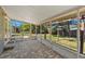 Spacious screened porch with stone pavers, providing an ideal outdoor living space and lovely backyard views at 707 24Th Sw St, Largo, FL 33770