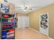 Storage room featuring laminate floors, shelving, a fan, and a closet at 707 24Th Sw St, Largo, FL 33770